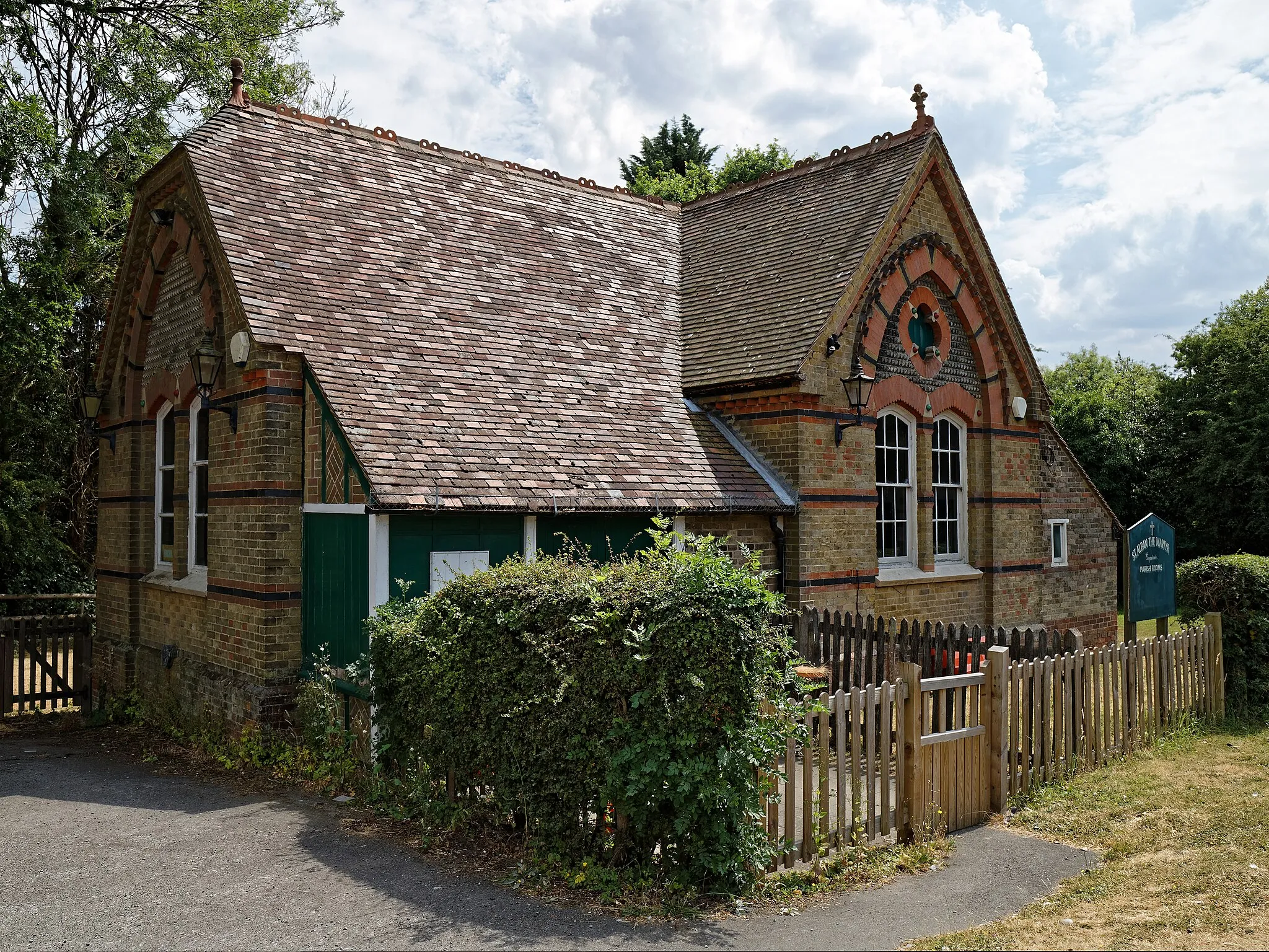 Photo showing: The Grade II listed 1882 parish rooms church hall originally built to accommodate a Sunday School for the Church of St Alban the Martyr, at the point where Coopersale Common Road becomes Houblons Hill in Coopersale, in the civil parish of Epping, Essex, England. Camera: Canon EOS 6D Mark II with Canon EF 24-105mm F4L IS USM lens. Software: File lens-corrected, optimized, perhaps cropped, with DxO PhotoLab, and likely further optimized with Adobe Photoshop CS2.