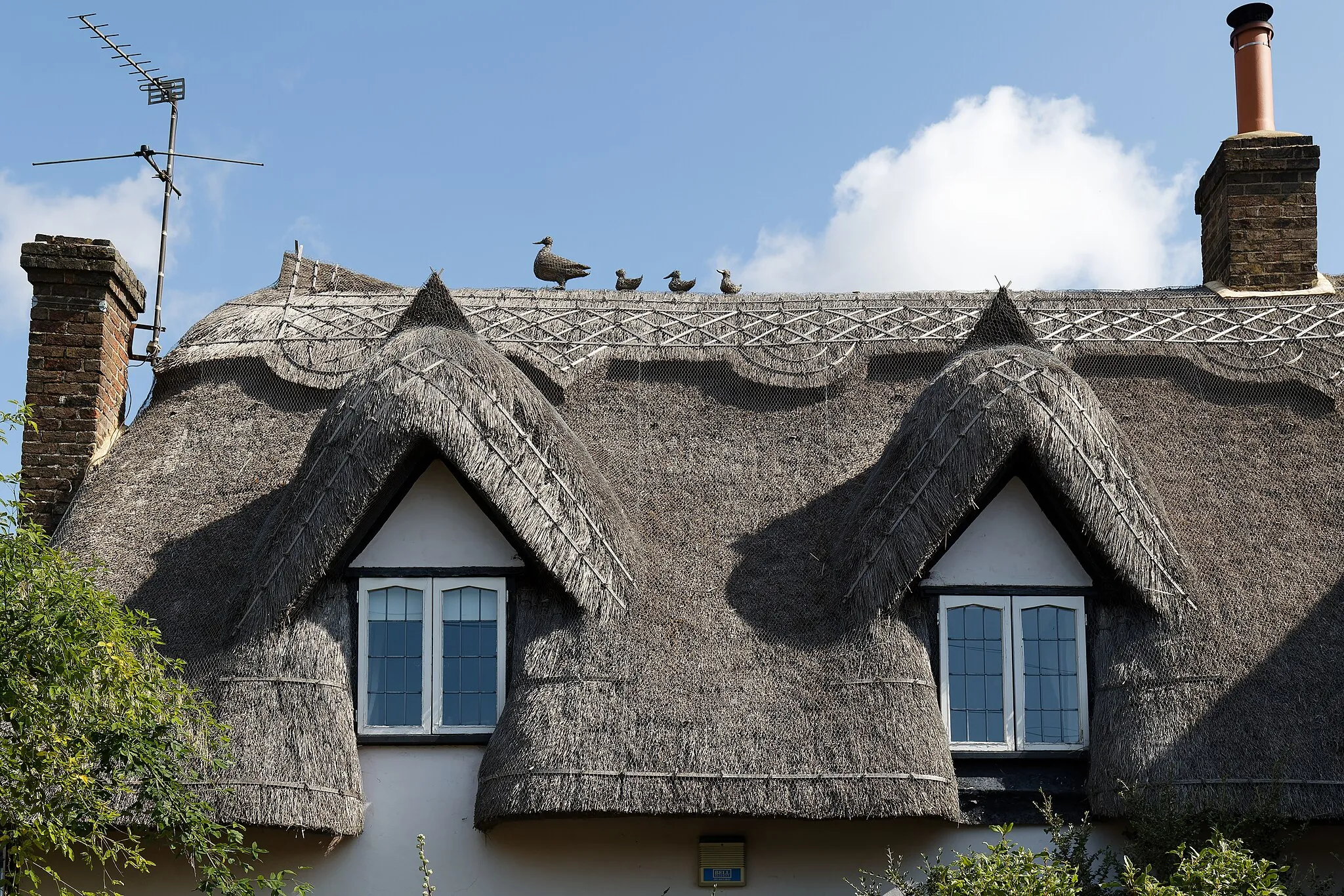 Photo showing: Thatched roof at Hatfield Heath Essex, England. To see relevant allied photos, click on this uploader's photos. For links to categories for images related to this photo in a variety of ways, go to the bottom of the page. Camera: Canon EOS 6D Mark II with Canon EF 24-105mm F4L IS USM lens. Software: RAW file lens-corrected, optimized and converted with DxO PhotoLab 6 Elite.