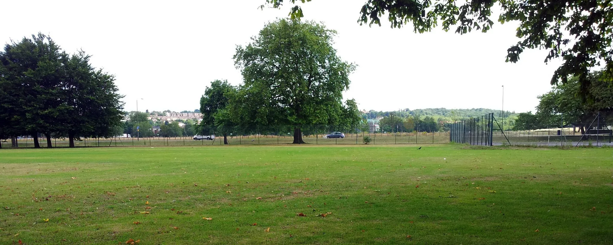 Photo showing: View of the southern section of Woolwich Common with Ha-ha road, Woolwich, Southeast London. In the foreground Barrack Field (Royal Arillery Barracks). In the background Shooters Hill.
