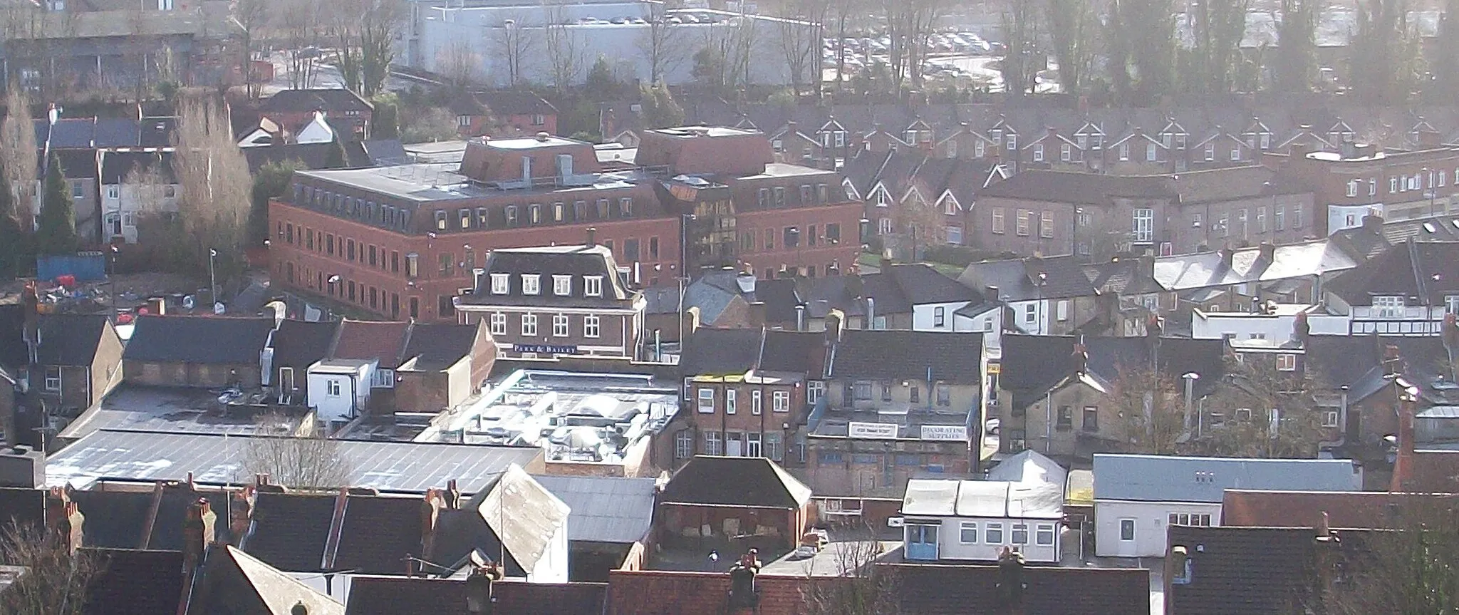 Photo showing: The centre of Coulsdon, London Borough of Croydon, England taken from the top of St Andrews Church. The most prominent building (with two lift rooms on the roof) is Sentinel House, 163 Brighton Road housing the European offices of Jane's Information Group. To the right of that is Coulsdon Library built in the shape of an open book.