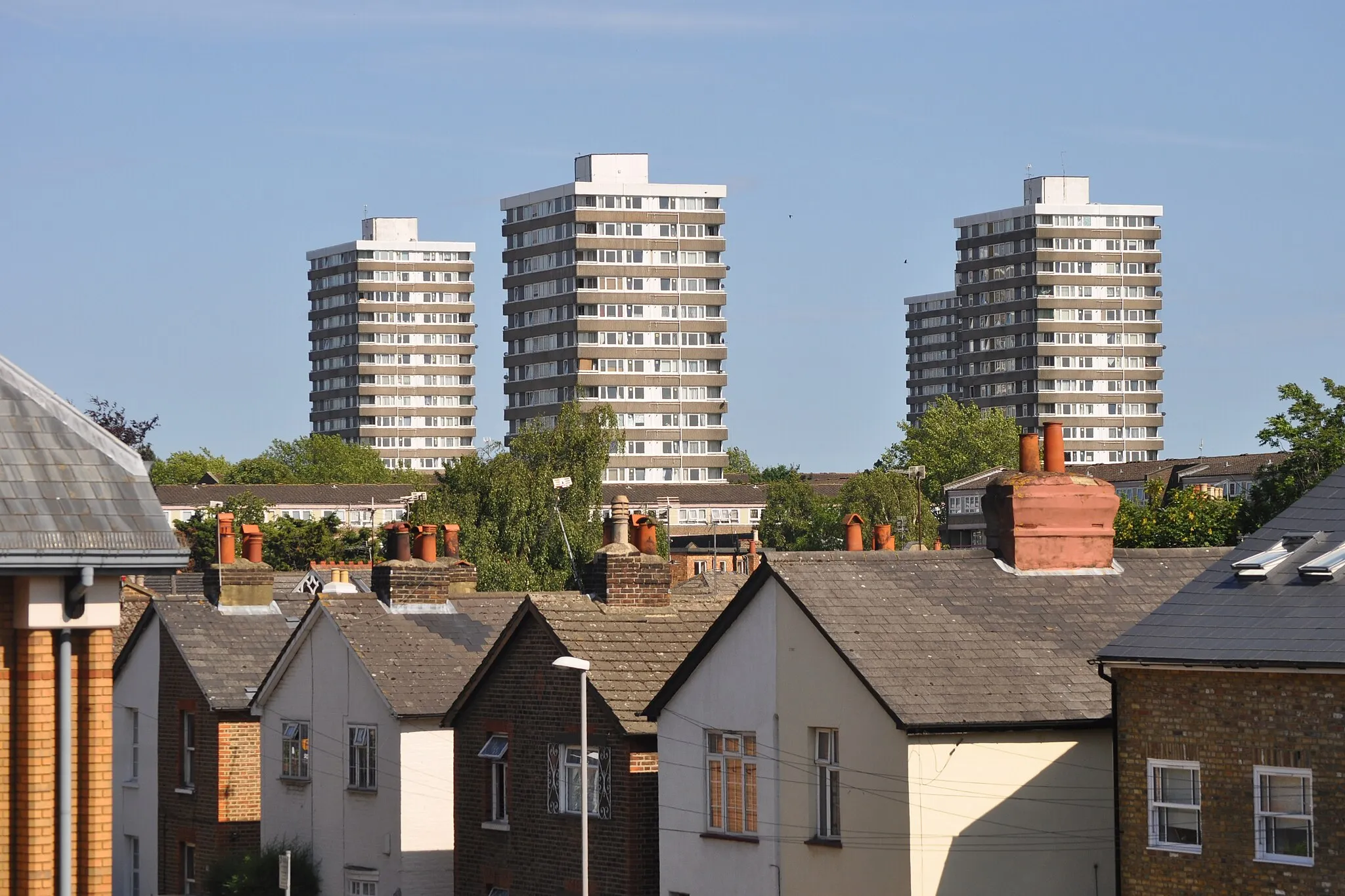 Photo showing: Showing the towers of the 1970s Cambridge Road council estate above more traditional low rise housing in the Norbiton area.