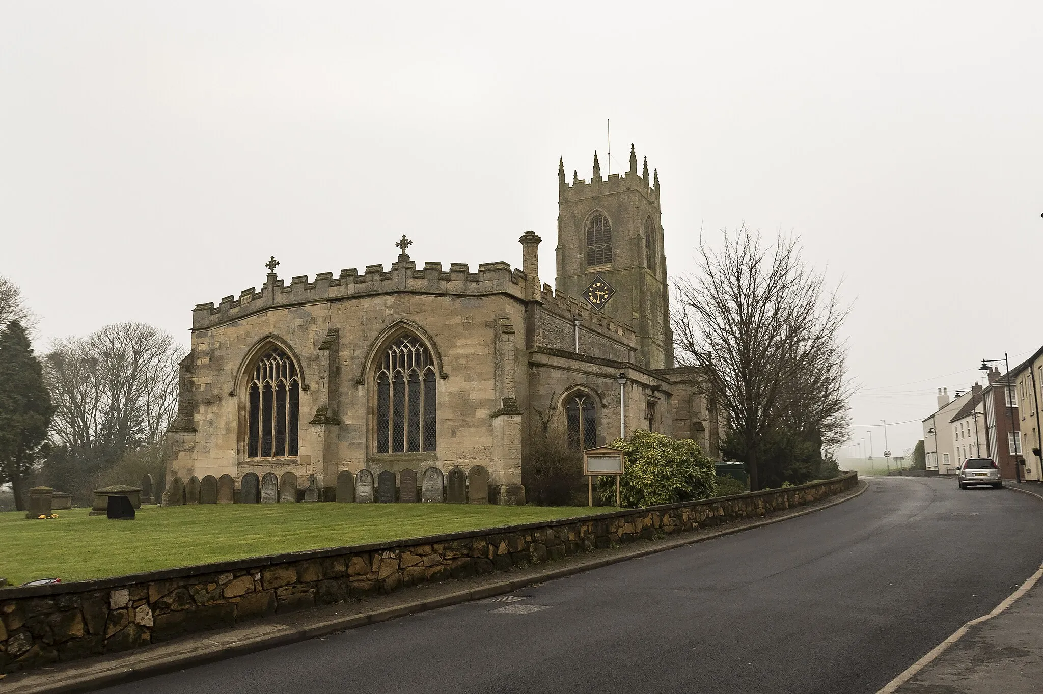 Photo showing: Grade I listed
The church dates from the twelfth century onwards, having a Norman four bay north arcade with round piers, scalloped capitals and square abaci.
There is a western tower, nave with north and south aisles and clerestory, a transeptal chapel, now a vestry, three bay chancel with north chapel, and north and south porches.
The tower is perpendicular with four stages and an embattled parapet with eight crocketted pinnacles. There are six bells, and a carillon which plays three hymn tunes.
The nave has a four bay north aisle, a five bay south aisle, and clerestory with three light windows. Most of the glass in the church is clear.
The nave has a low pitched roof with bosses. There is a fifteenth century octagonal font with trefoil panels.
In the north chapel, there is a fifteenth century effigy of a priest near the wall.
The chancel has a four light east window with prayer boards either side, and blind arcading with textured tiles.
The east end of the chancel and chapel were rebuilt in the mid eighteenth century, and again in the mid nineteenth century. There were also restorations from 1895 to 1903 by Prothero.

There is a two manual organ on the north side of the chancel.