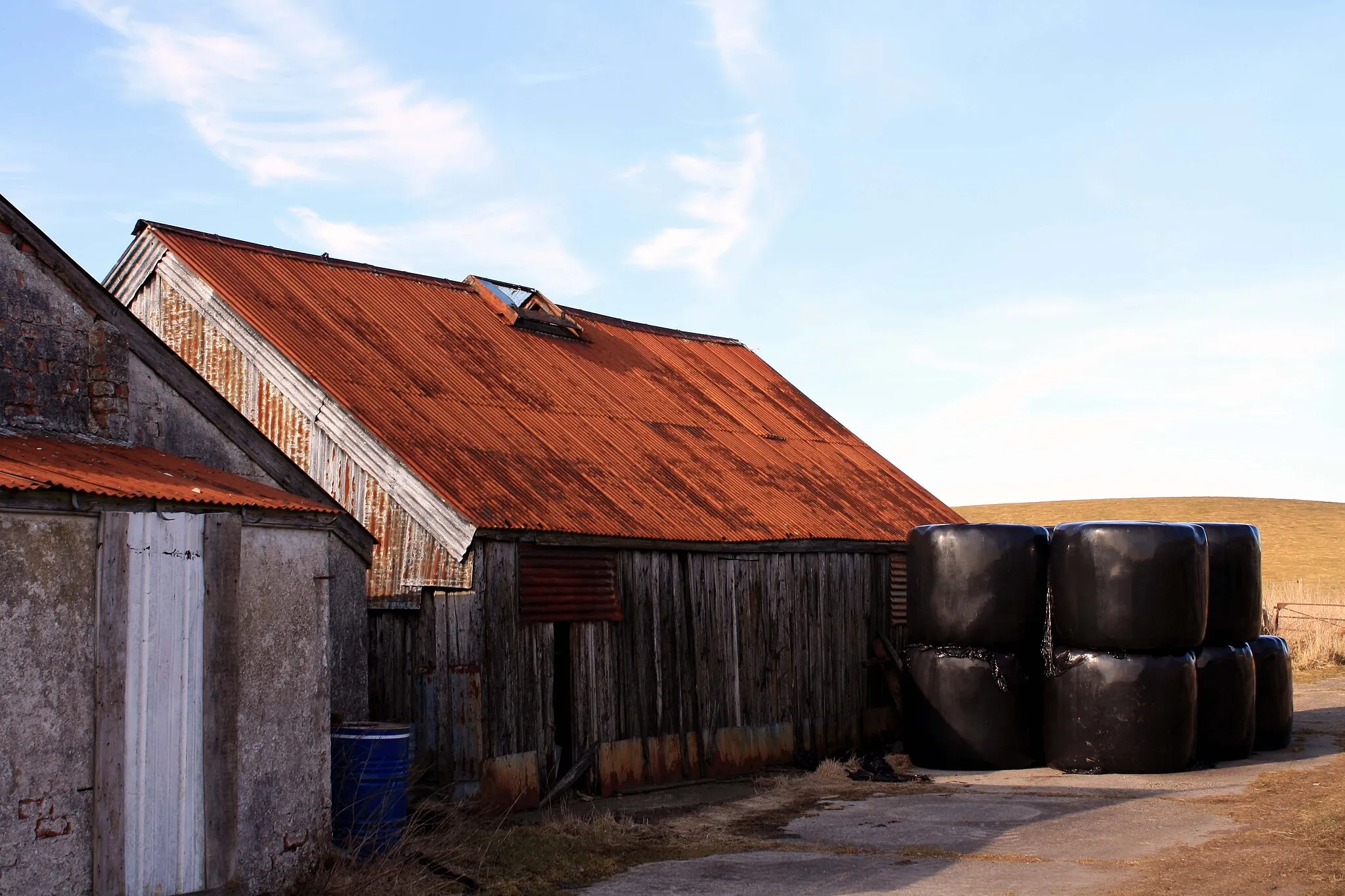 Photo showing: Bales and Barn Stacked bales next to outbuildings on Wheatcroft Farm.