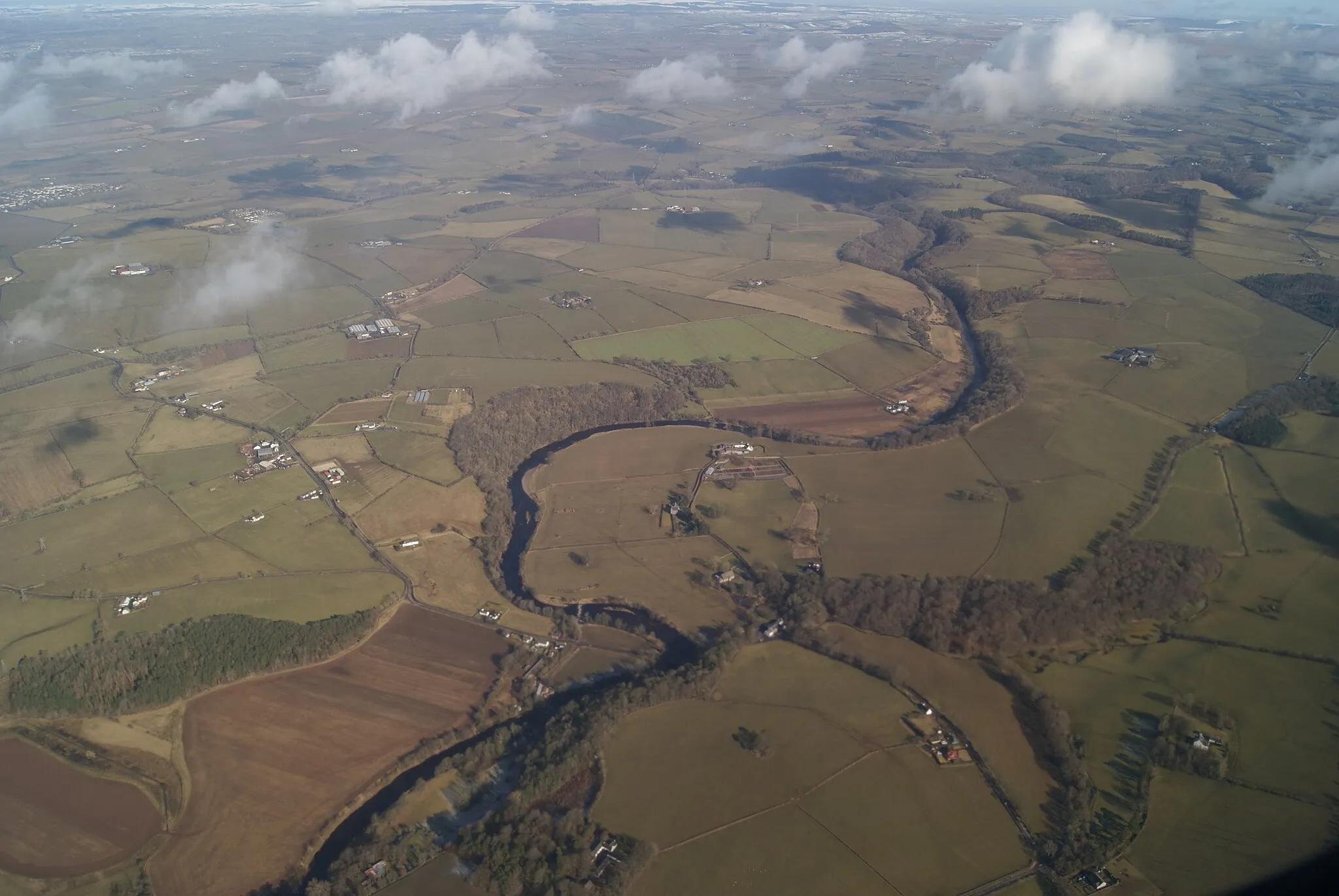 Photo showing: River Ayr at Stair Viewed from a Ryanair plane which has just taken off from Prestwick Airport. The weir at Stair can be seen in the lower half of the photo.