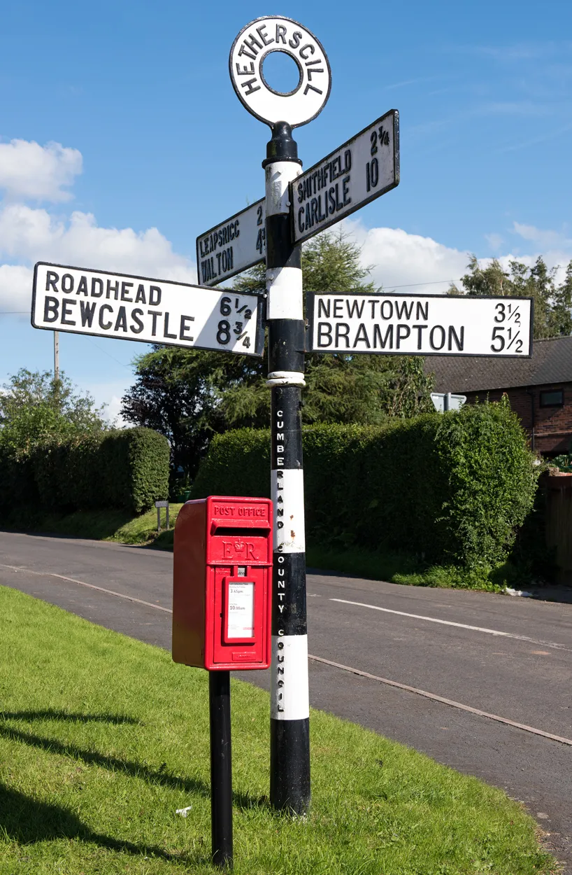 Photo showing: Signpost and postbox, Hethersgill - August 2016