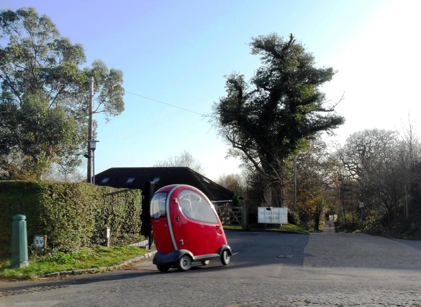 Photo showing: A mobility scooter enters Pouchlands Drive, South Chailey