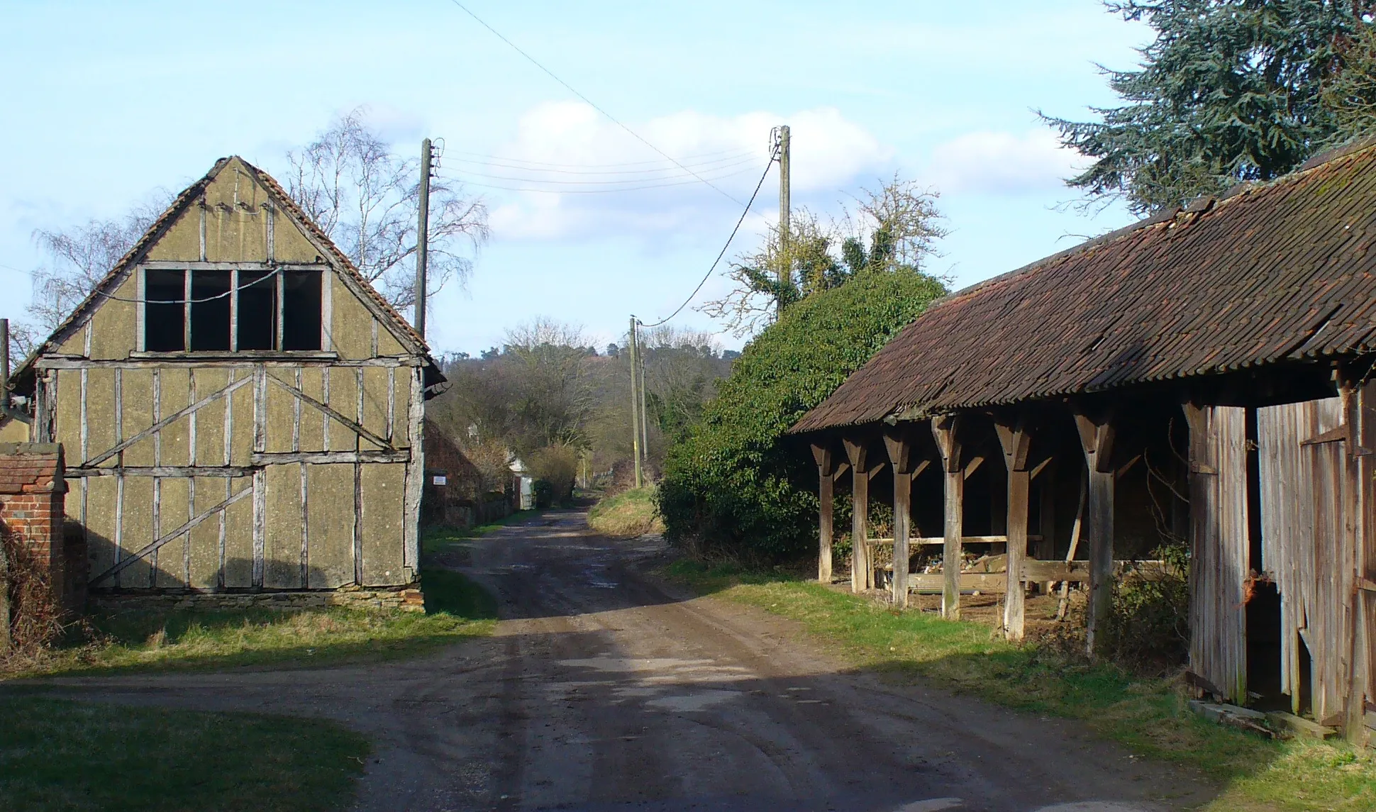 Photo showing: Bridleway at Great Tangley Manor Farm Wide track passing between picturesque, but somewhat tumbledown, barns.