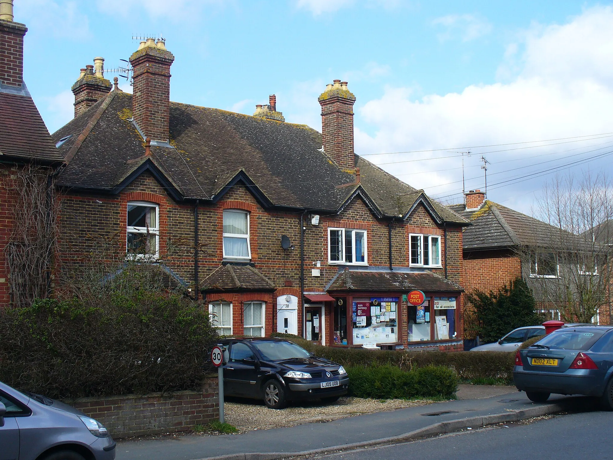 Photo showing: Chilworth Post Office Old red brick Victorian cottages on New Road, Chilworth - now housing the village's Post Office.