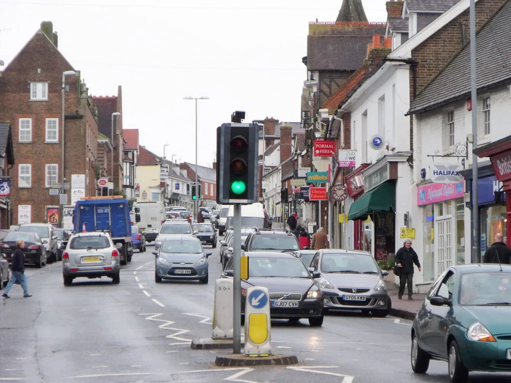 Photo showing: The High Street, Uckfield It was said that when the station was placed on the other side of the main road, thus avoiding the use of a level crossing, the traffic would flow more freely through the town centre. Yet, with the increase of cars on the road it seems to have made no difference and this photo wass taken before the 'School Run' and rush hour.