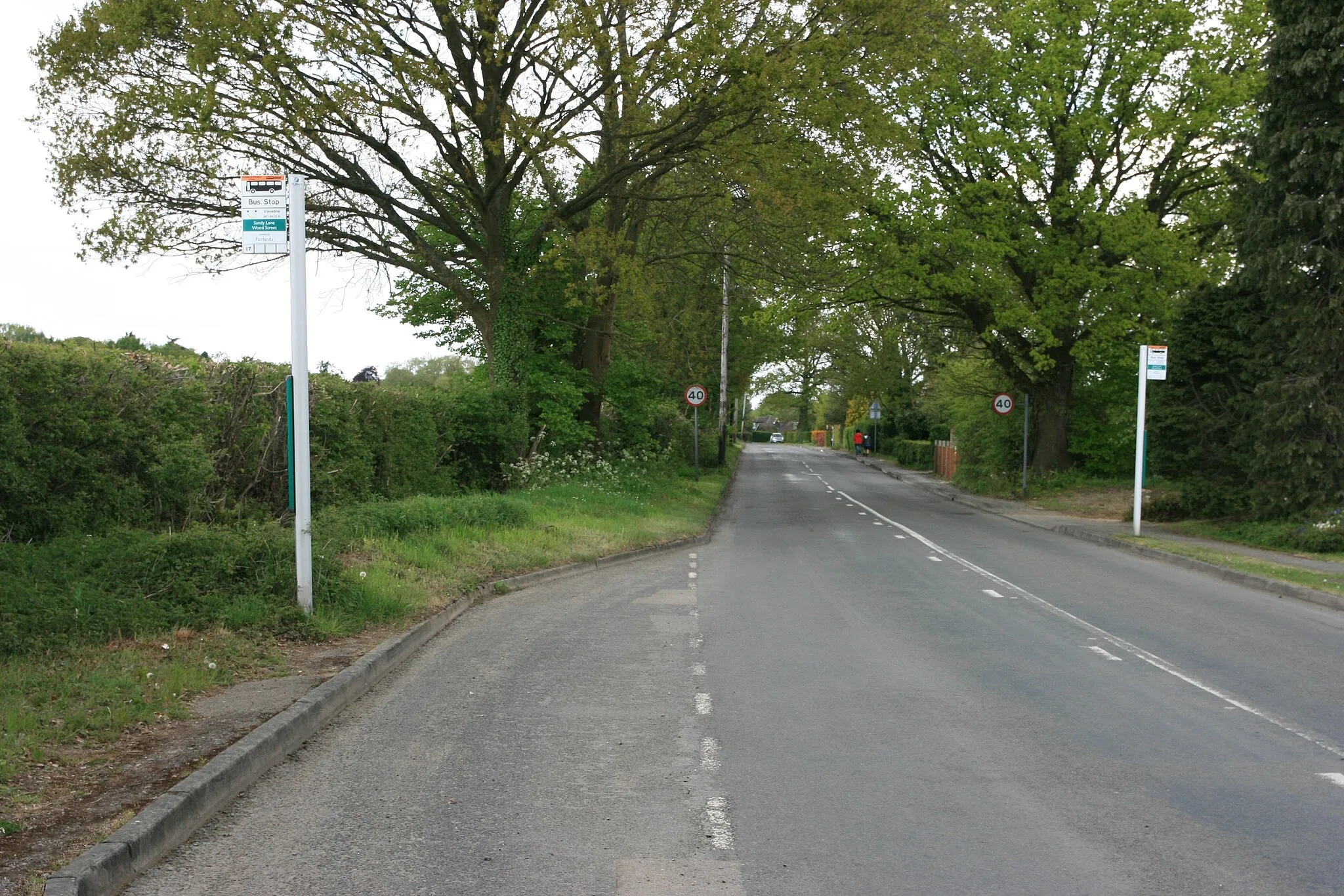 Photo showing: Bus stops, Wood Street Village, near to Wood Street Village, Surrey, Great Britain. When seen, they were served by route 17 to and from Guildford.