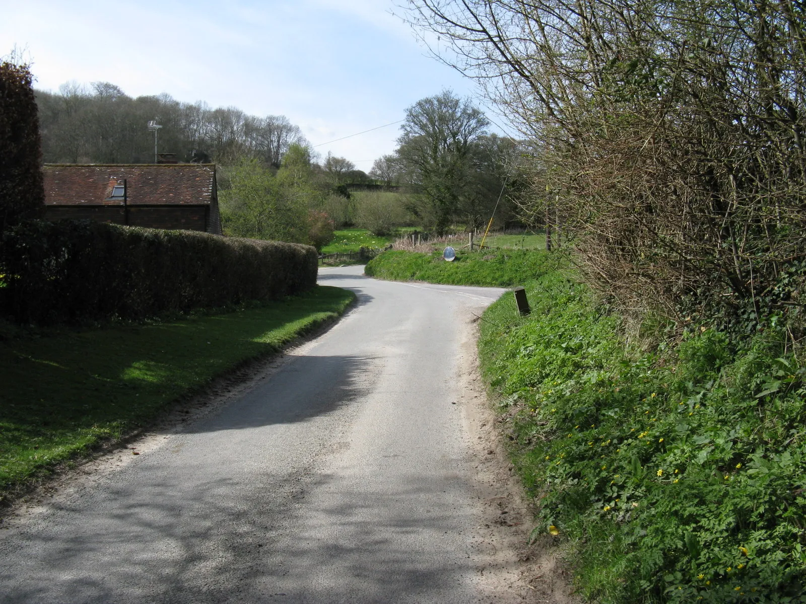 Photo showing: Road mirror at junction Folly Lane and road to Burton Mill