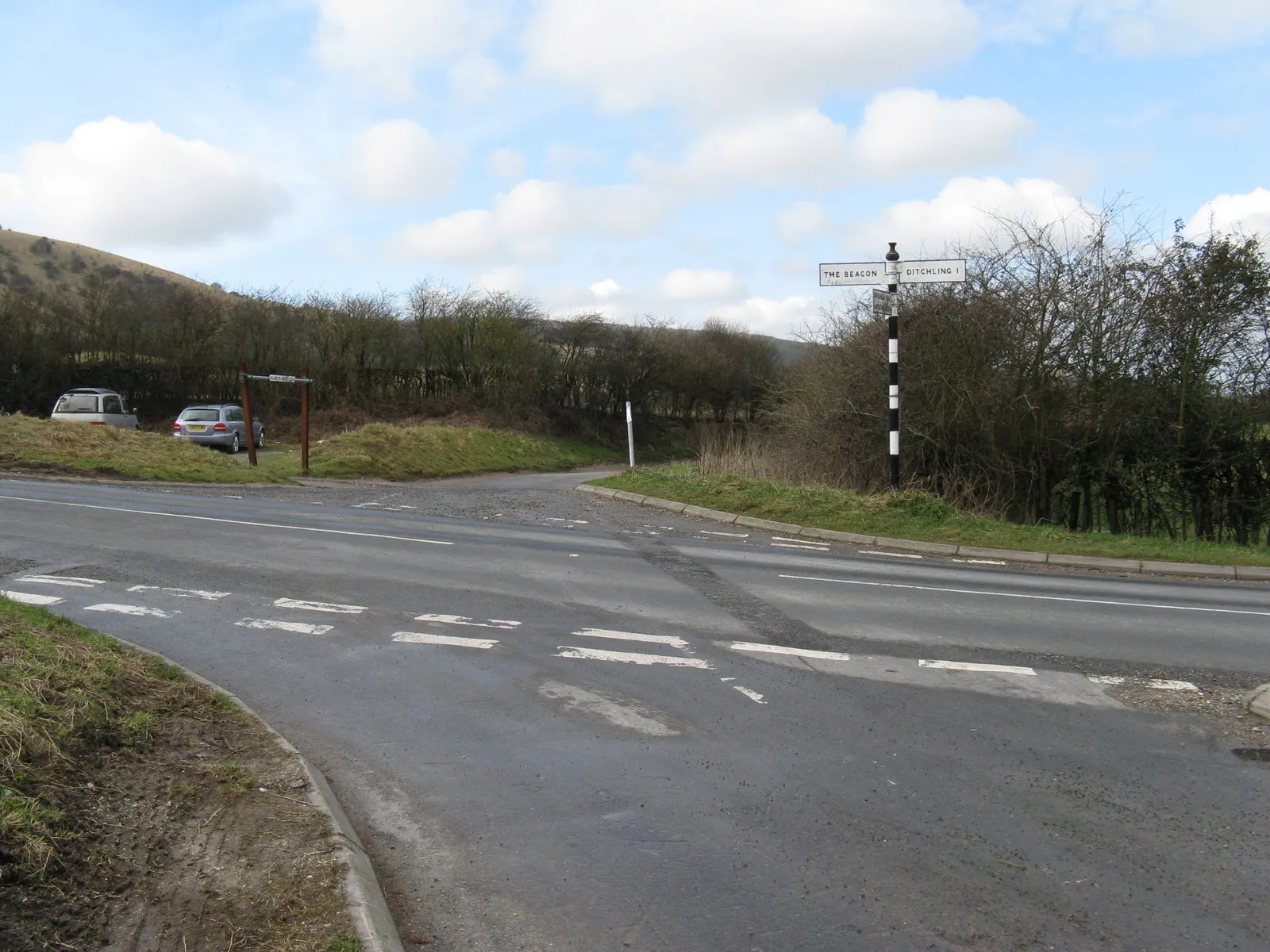 Photo showing: Car park at crossroads at the bottom of Ditchling Beacon Underhill Lane is the road that gives way