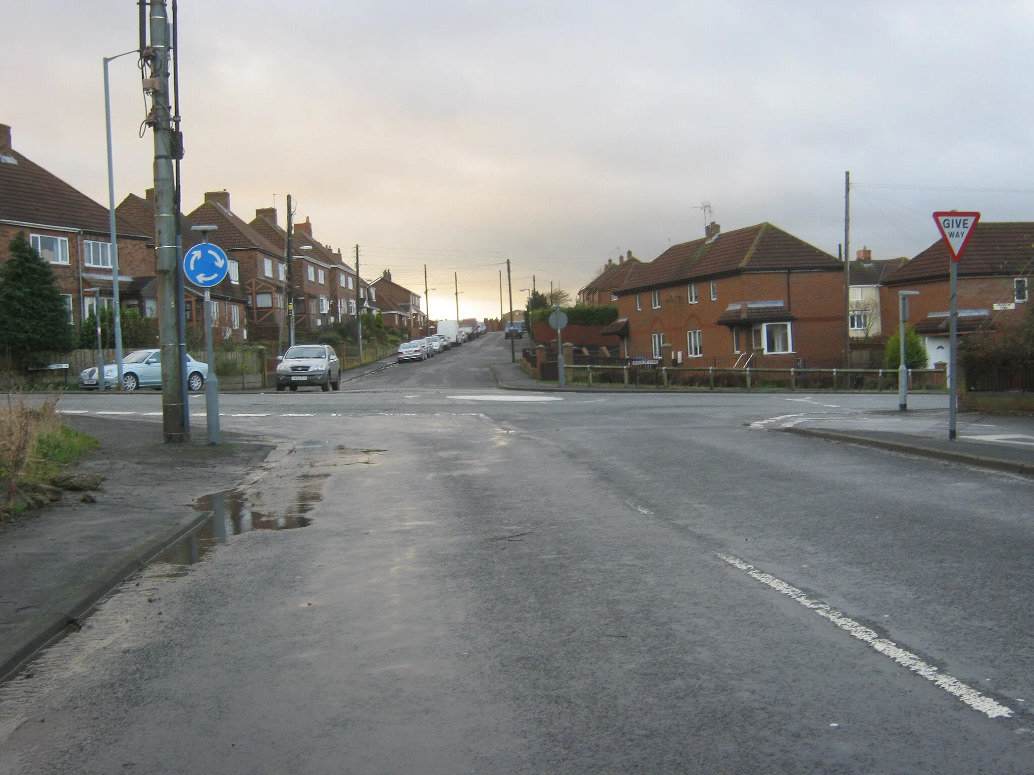 Photo showing: Road from Hutton Henry joining the B1280 at mini- roundabout in Station Town