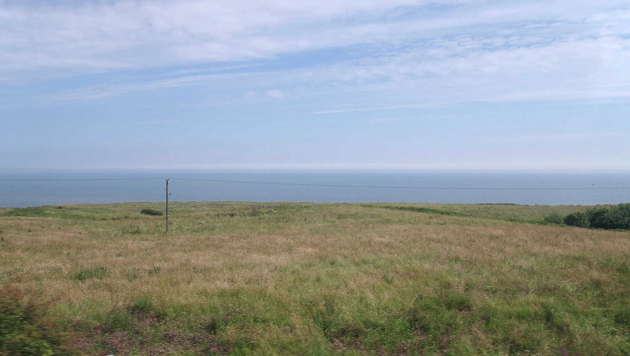 Photo showing: Looking out to sea from a train on the Durham Coast Line near Blackhall Rocks.