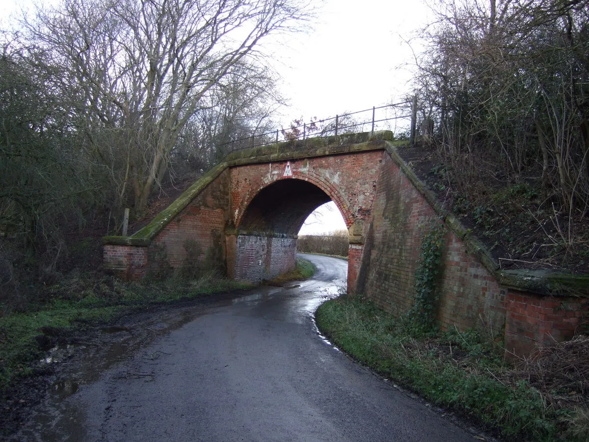 Photo showing: Disused railway bridge over Haggit Hill Lane