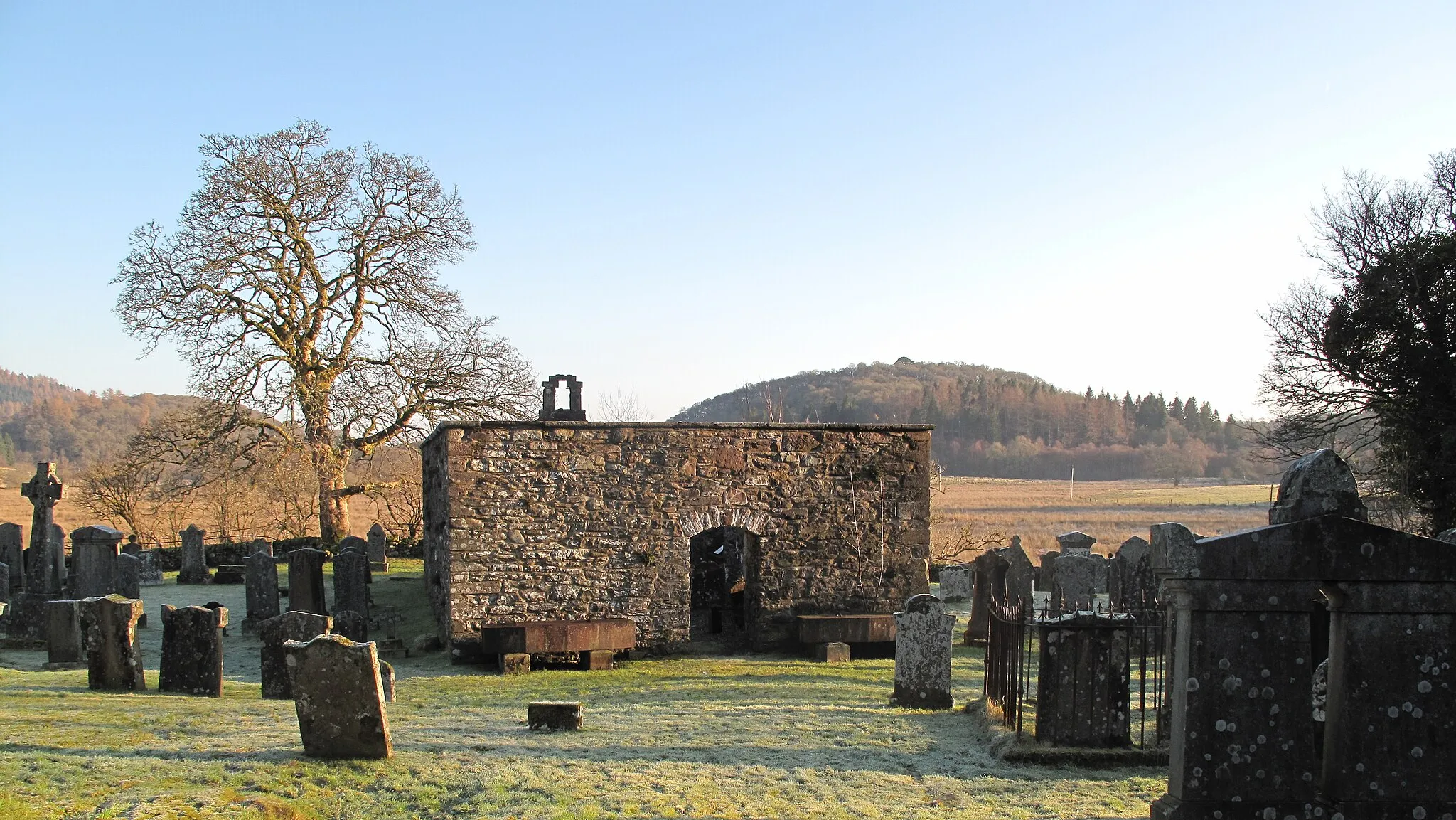 Photo showing: Image of the Old Kirk Graveyard in Kirkton Aberfoyle where visitors can see the grave of the Rev Robert Kirk and the Mort Safes at the entrance to the Old Kirk designed to thwart grave robbers