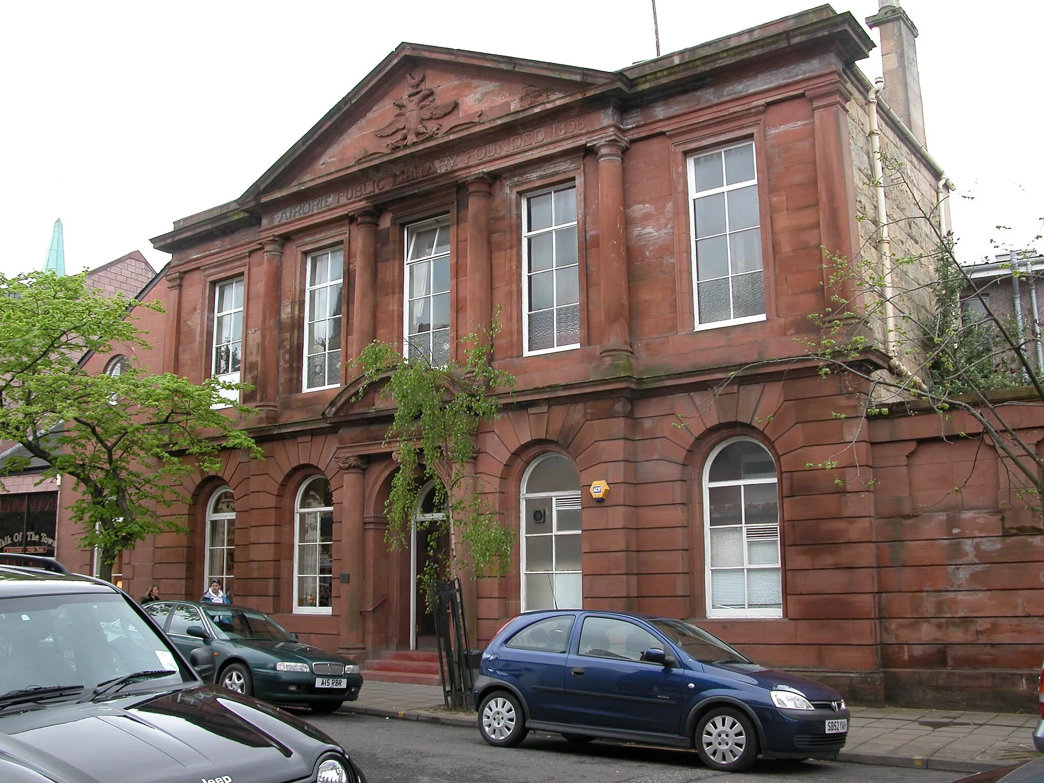 Photo showing: Airdrie Public Library building (opened 1894) on Anderson Street. The foundation date of 1856 visible on the facade relates to the library's first home