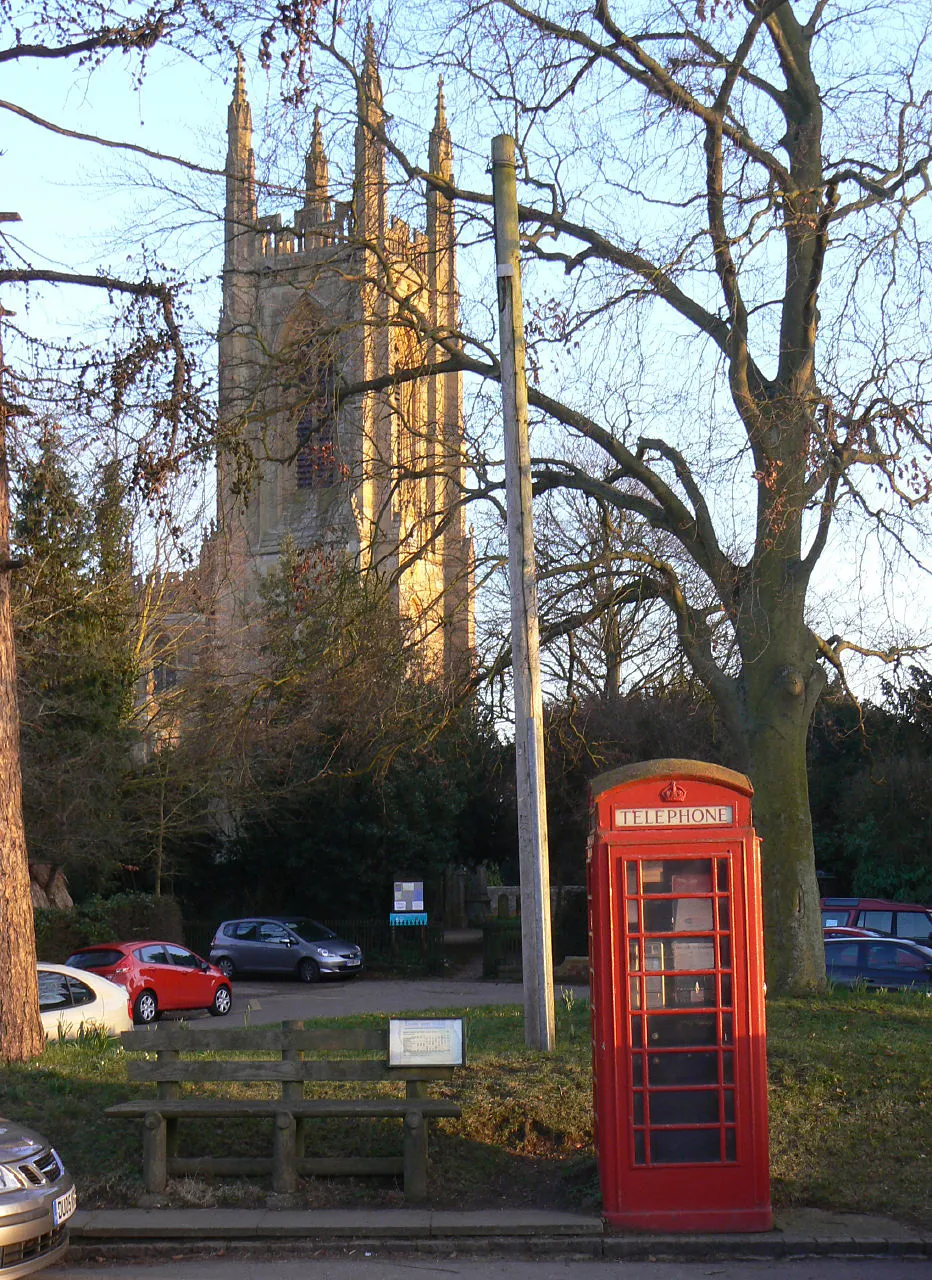 Photo showing: Phone box, bus stop and church