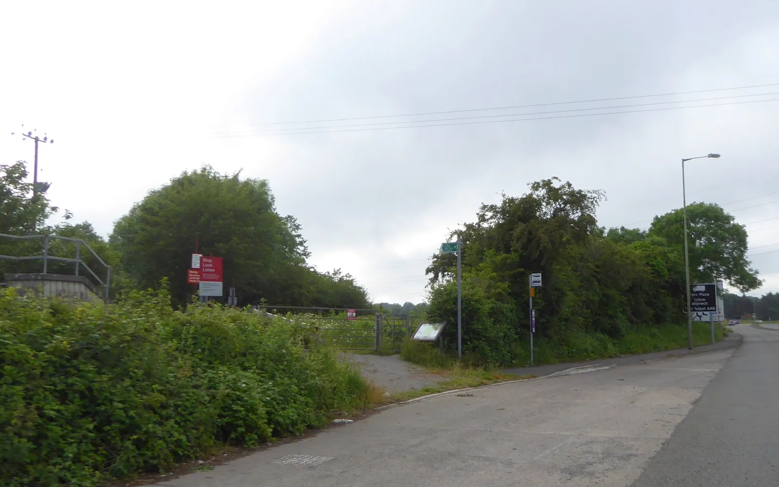 Photo showing: Bus stop by A48 and footpath to Ewenny Priory