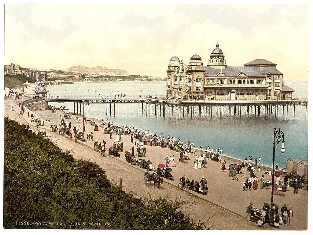 Photo showing: [Pier and Pavillion, Colwyn Bay, Wales] [between ca. 1890 and ca. 1900].
1 photomechanical print : photochrom, color. Notes: Title from the Detroit Publishing Co., catalogue J--foreign section. Detroit, Mich. : Detroit Photographic Company, 1905.
Print no. "11290".
Forms part of: Views of landscape and architecture in Wales in the Photochrom print collection. Subjects: Wales--Colwyn Bay. Format: Photochrom prints--Color--1890-1900. Rights Info: No known restrictions on reproduction. Repository: Library of Congress, Prints and Photographs Division, Washington, D.C. 20540 USA, http://hdl.loc.gov/loc.pnp/pp.print Part Of: Views of landscape and architecture in Wales (DLC)  2001700652
More information about the Photochrom Print Collection is available at http://hdl.loc.gov/loc.pnp/pp.pgz Persistent URL: http://hdl.loc.gov/loc.pnp/ppmsc.07399
Call Number: LOT 13408, no. 063 [item]