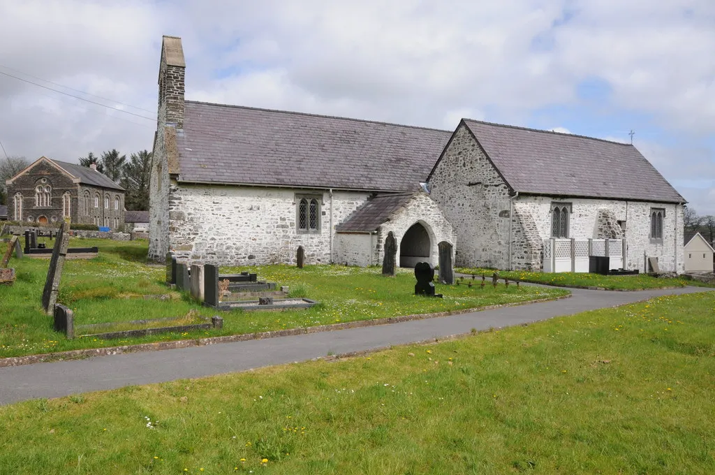 Photo showing: Llansadwrn  church. Llansadwrn church is dedicated to St Sadwrn. In the background to the left is what appears to be a Methodist church.