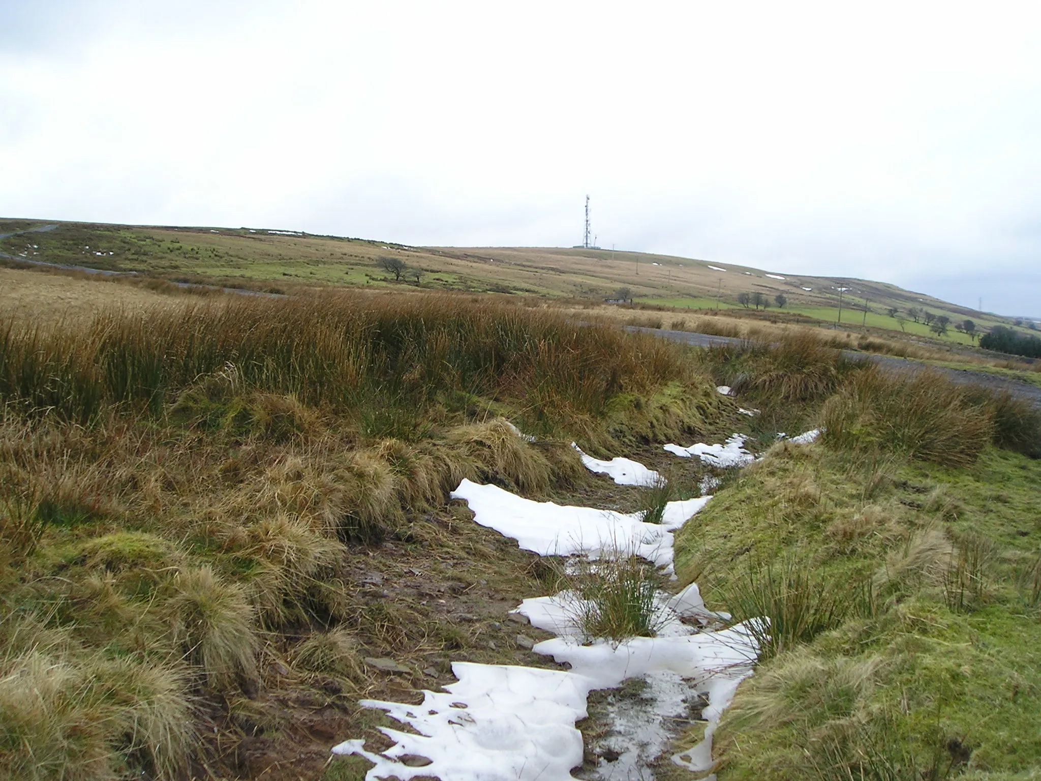 Photo showing: The Snow Lingers View across the moorland towards the telecommunications mast.