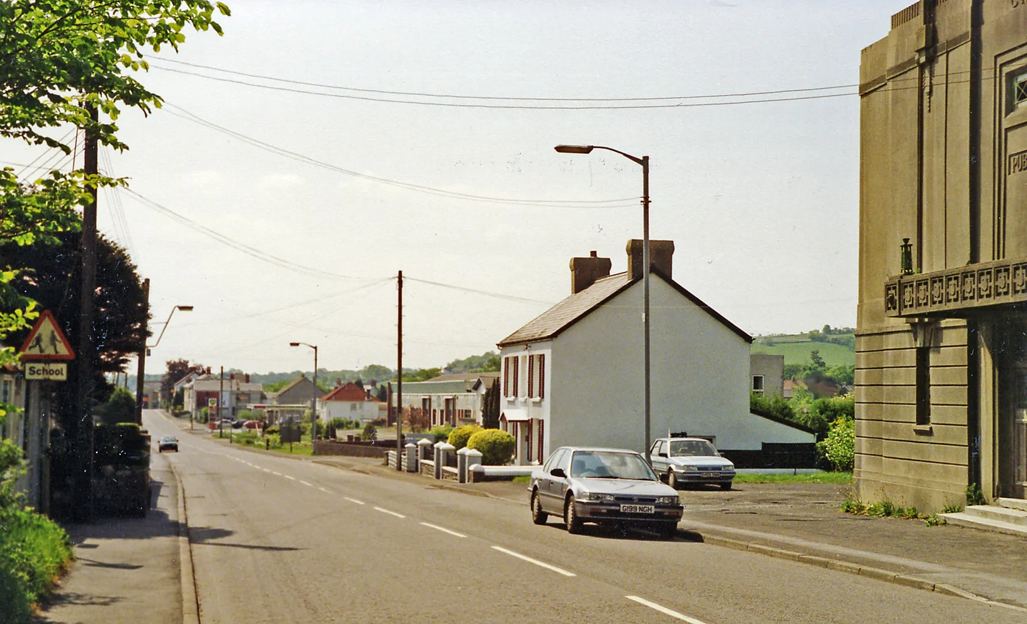 Photo showing: Site of Cross Hands station, 1990.
View SE on the A48, the station had been on the right: terminus of the ex-GW Llanelly & Mynydd Mawr line. Passenger services for colliery workers lasted until 1928, but freight up the Gwendraeth Valley continued until the colliery at Cynheidre closed in 1983.
