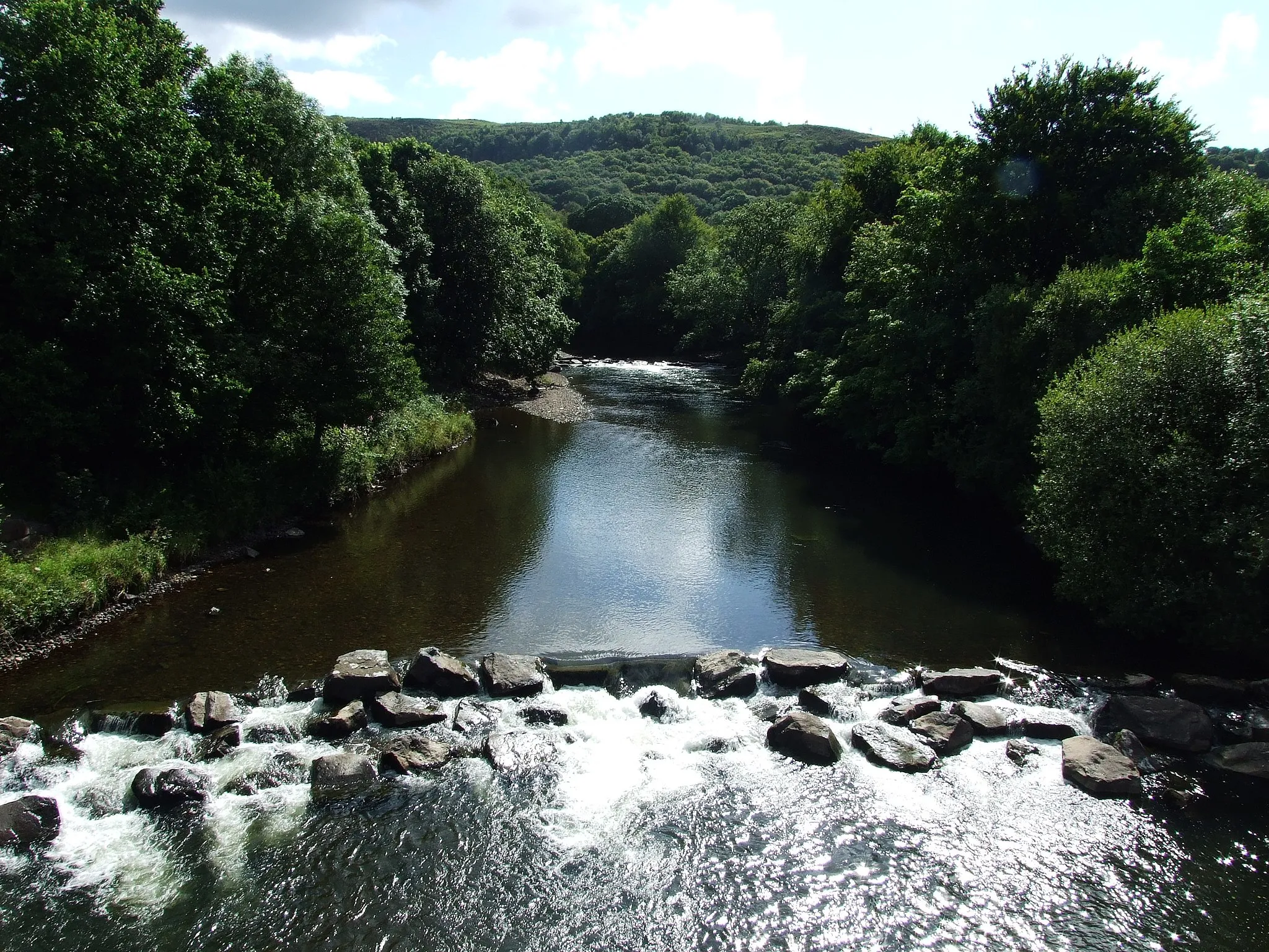 Photo showing: The River Tawe which is diverted by the moraine in Glais.