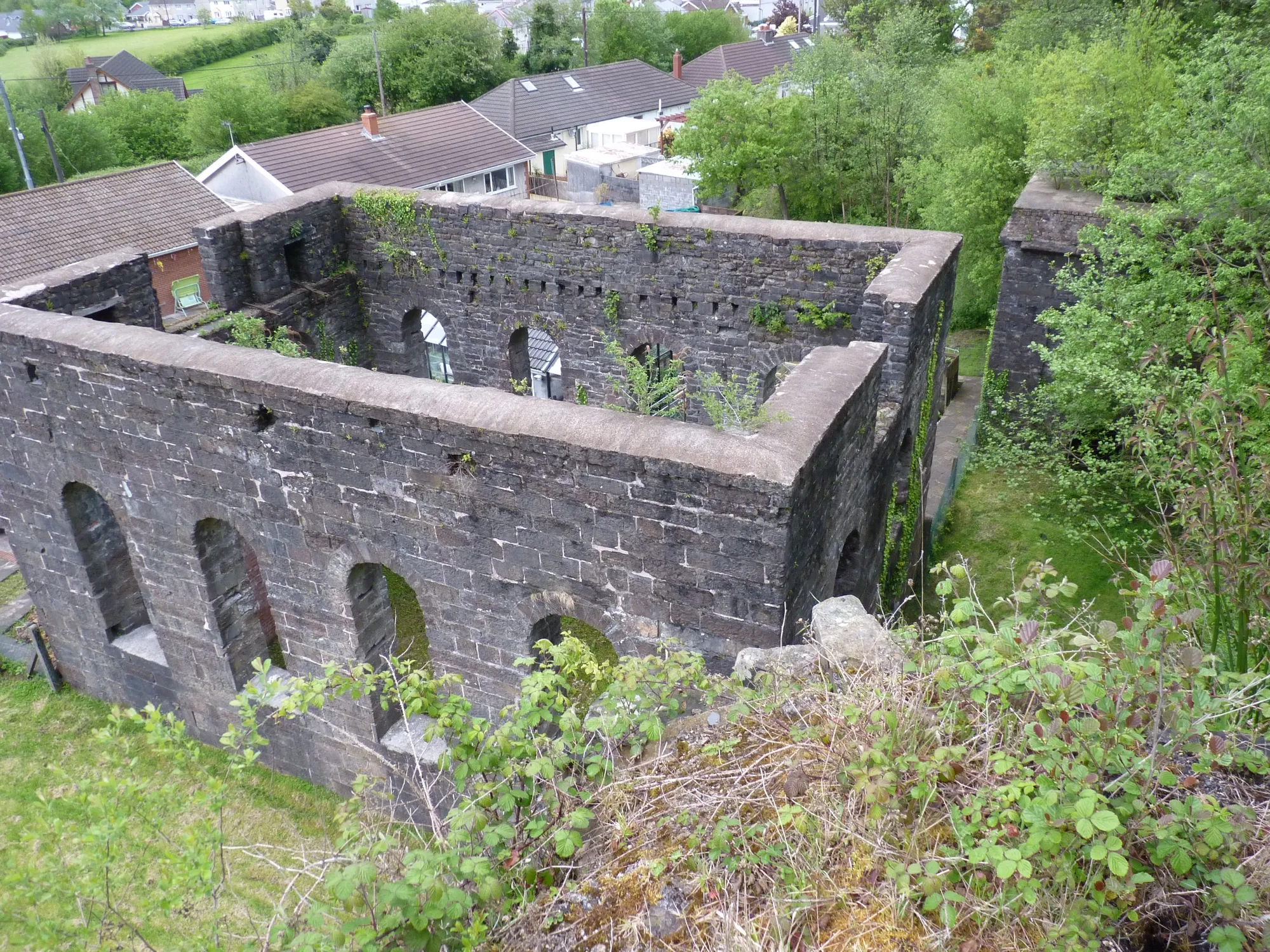 Photo showing: The blowing house, roofless but still intact, provided air for the blast furnaces which stood to the left of the picture.