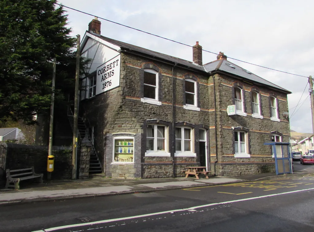 Photo showing: Corbett Arms, Bridge Street, Ogmore Vale
Pub viewed across the A4061 Bridge Street from the corner of Water Street.

The year 1876 is on the name sign.