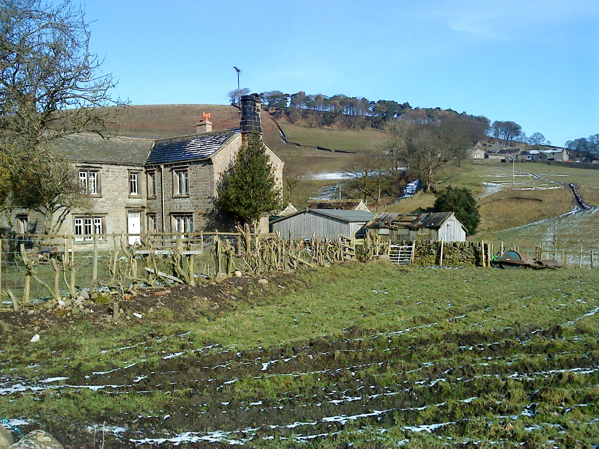 Photo showing: Low House Farm, Hazelwood The cluster of buildings on the hillside above Low House Farm is Hazelwood hamlet.