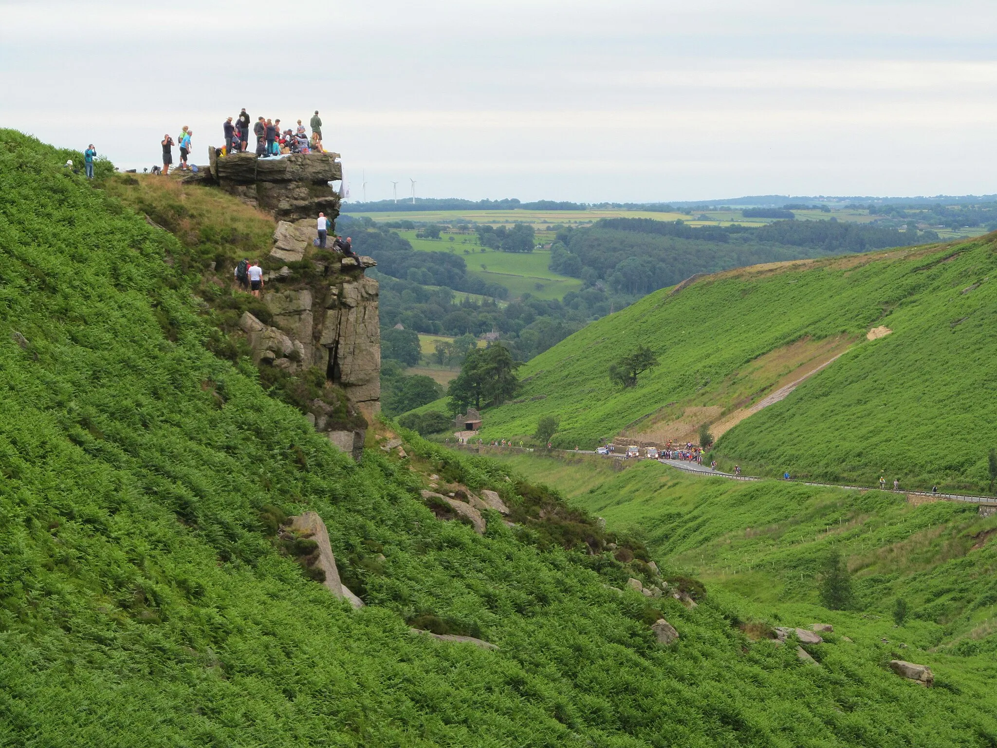 Photo showing: A small crowd begins to gather on the crag