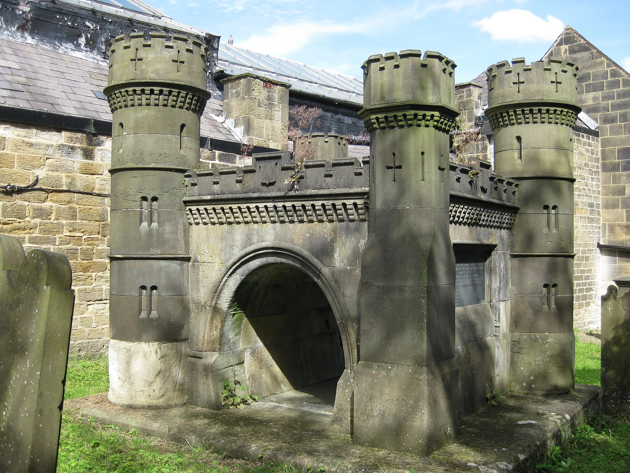 Photo showing: Navvies' Monument, Church Lane, Otley.  A model of the Bramhope Tunnel as a memorial to the navvies who died in its construction.