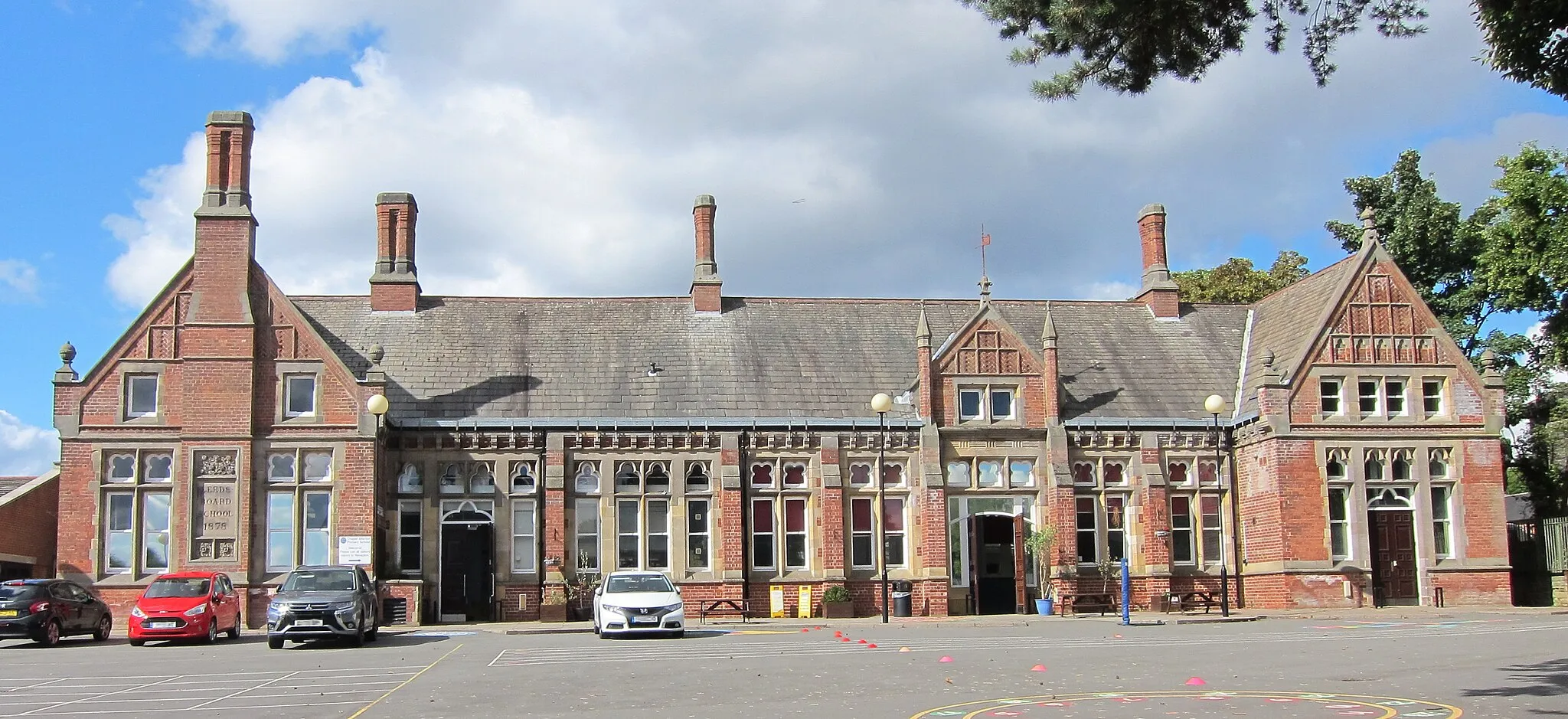 Photo showing: Listed building 1256030, dated 1878, red brick with stone dressings.  Still in use as a school.