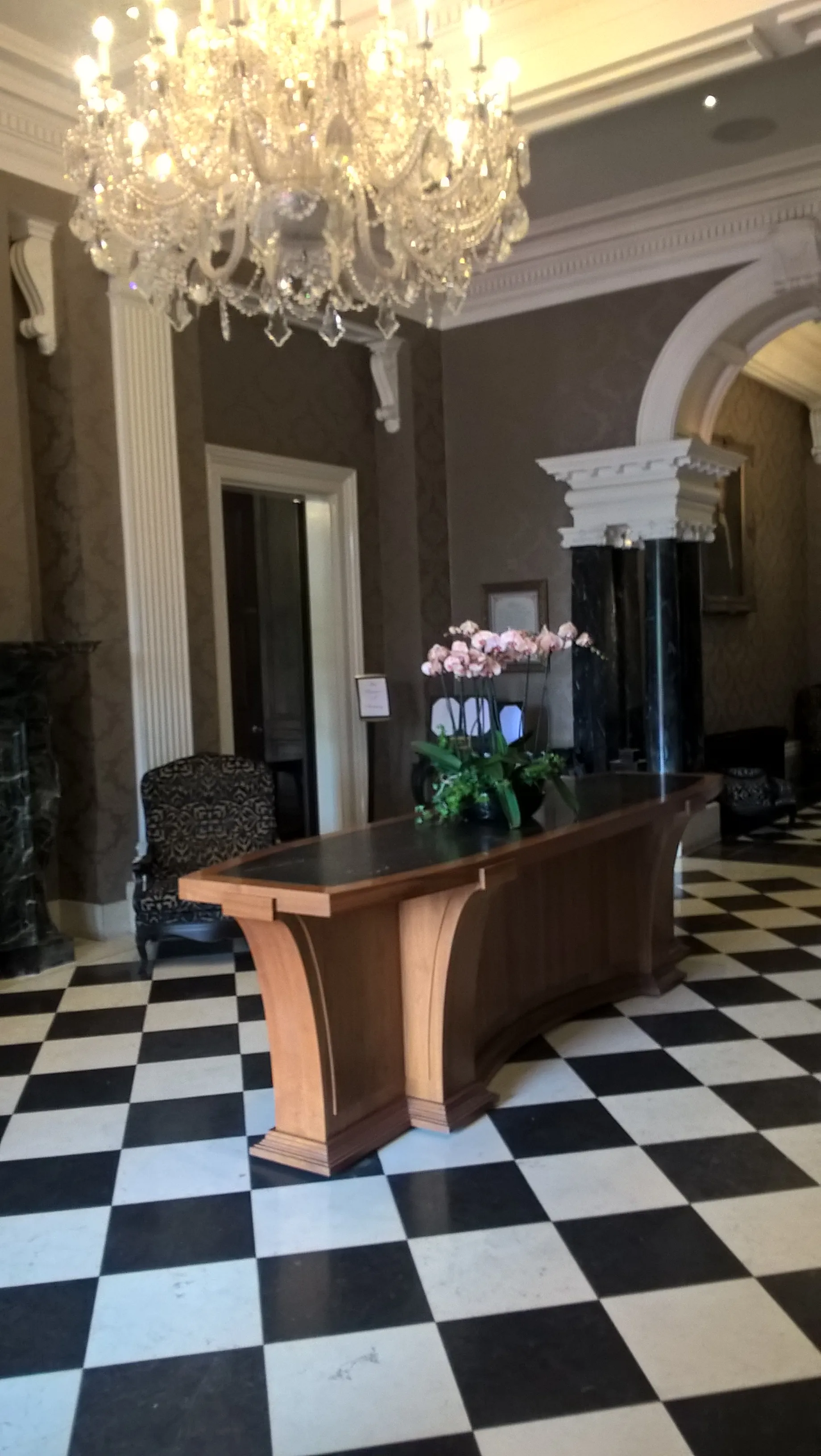 Photo showing: Lobby of Oulton Hall with chandelier and chequerboard floor.