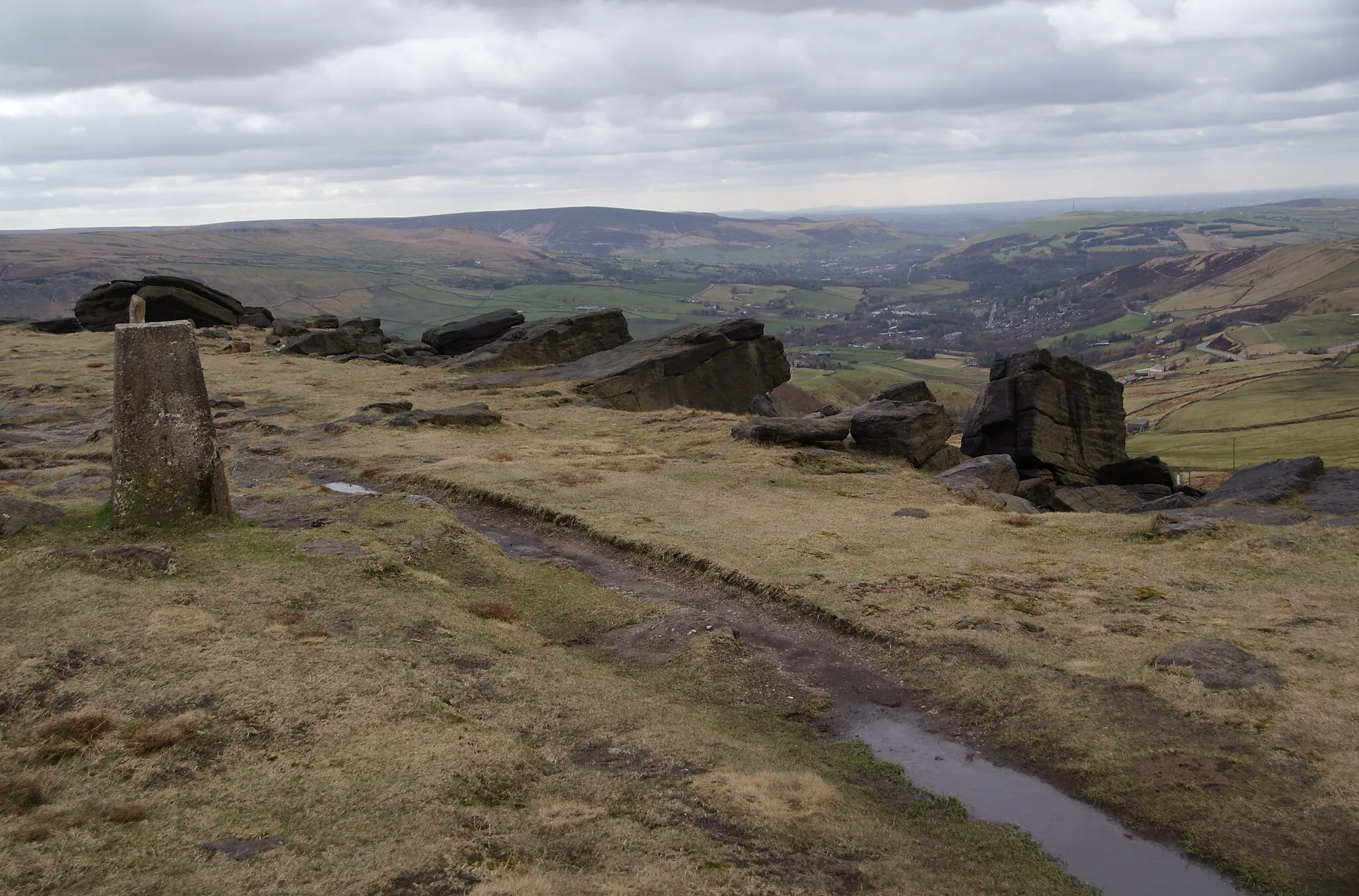 Photo showing: The trig point on Standedge There are clear views down to Greenfield and Alphin Pike.