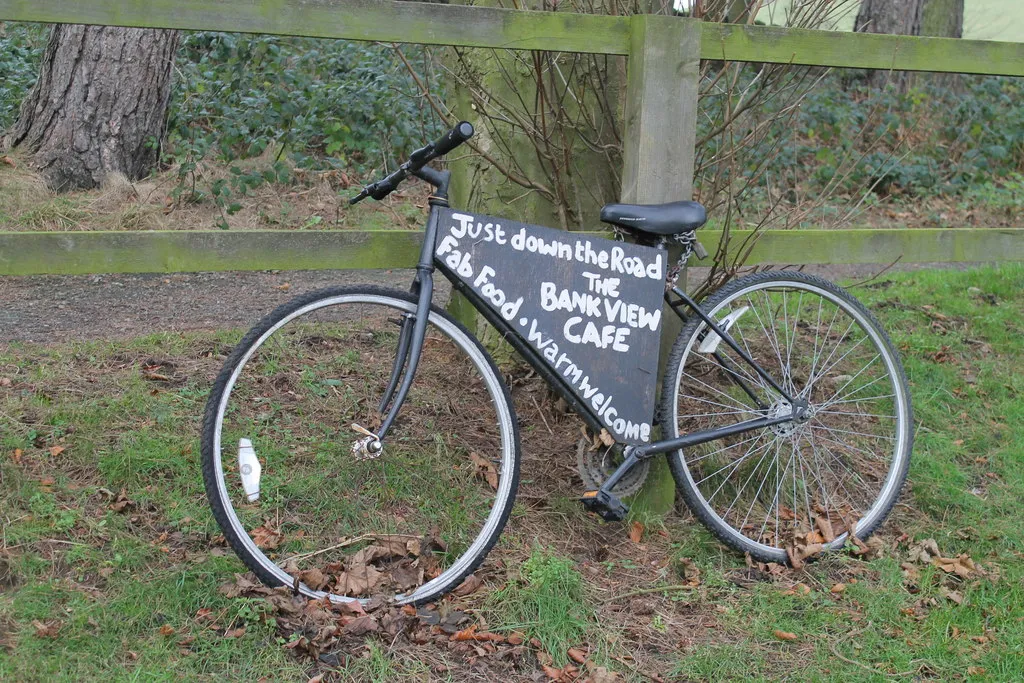 Photo showing: A bike advertises the local cafe.