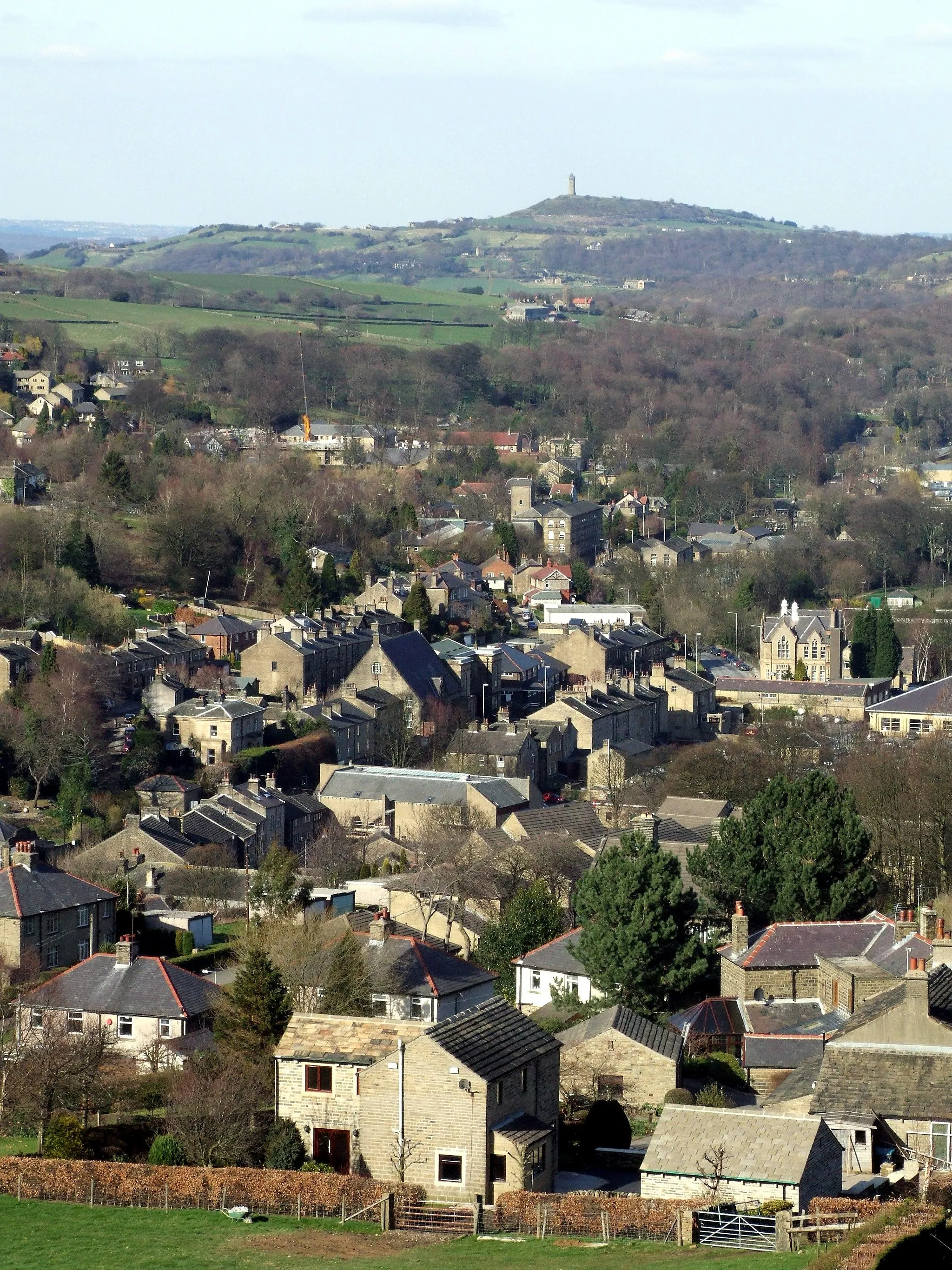 Photo showing: View across Holmfirth to Castle Hill, Huddersfield taken from Dunsley Bank Road