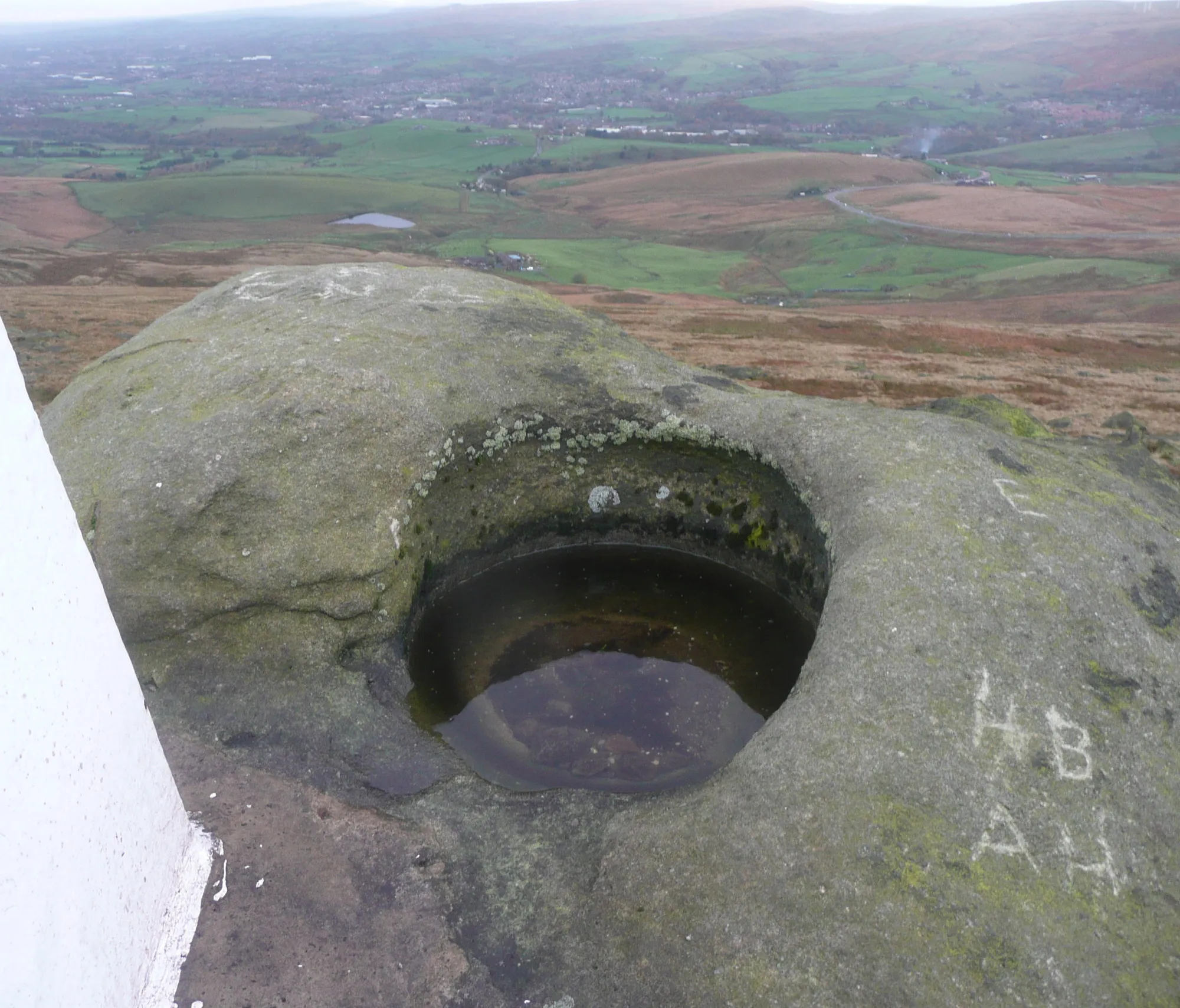 Photo showing: Basin in rock next to the triangulation pillar, Blackstone Edge